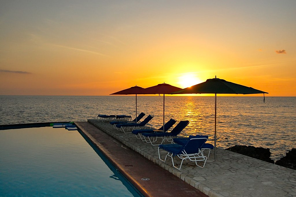 A sunset over the water in Negril Jamaica where cannabis tourism is popular